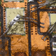 Renault sourced the DC/DC converter for the early Zoe models from Continental. The yellow rectangles are semiconductors - likely IGBT transistors - for the buck converter. They’re glued directly to a special, thermally conductive circuit board for optimum cooling.The silver bond wires are visible, connecting the silicon to the traces of the board.